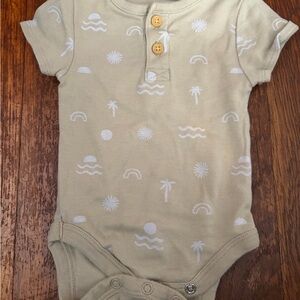 Charming Beige Kids Bodysuit with White Patterns